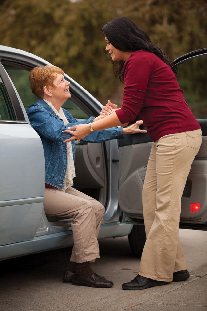 A Wellcare caregiver assisting a client