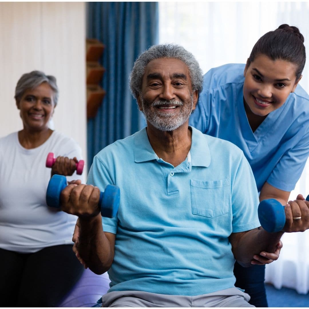 A specially trained caregiver assisting a client with Parkinson's-aware mobility support